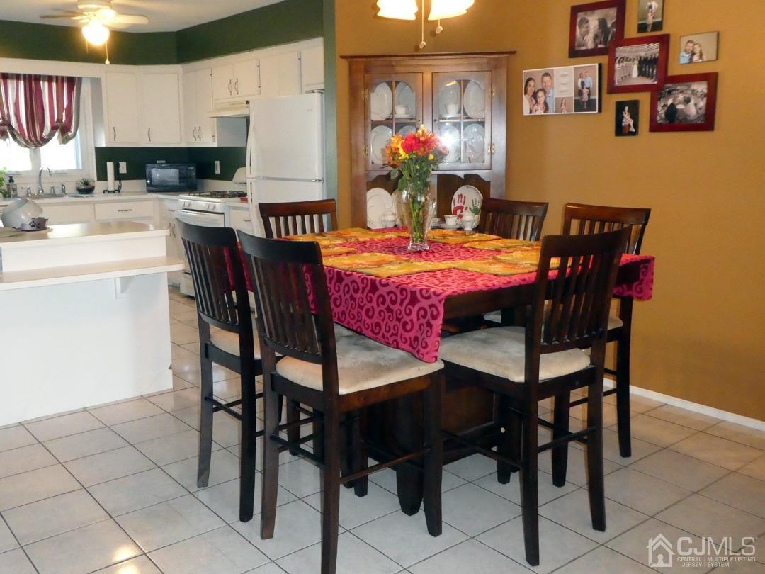 741 Bound Brook Road, Unit 3 Dunellen, NJ 08812 - Photo 4 of 14 a view of a dining room with furniture