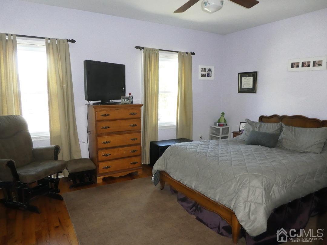 741 Bound Brook Road, Unit 3 Dunellen, NJ 08812 - Photo 7 of 14 a bedroom with a bed and a television