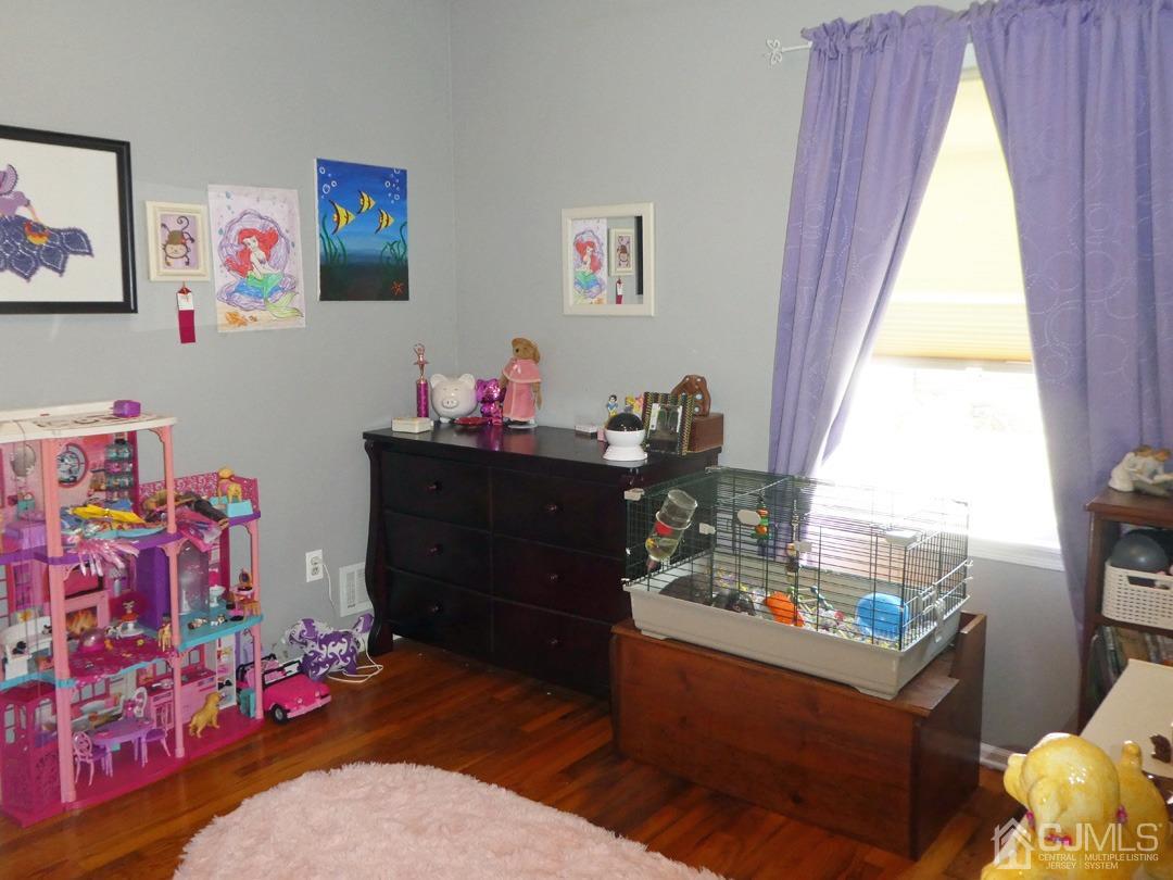 741 Bound Brook Road, Unit 3 Dunellen, NJ 08812 - Photo 8 of 14 a room with furniture and a window
