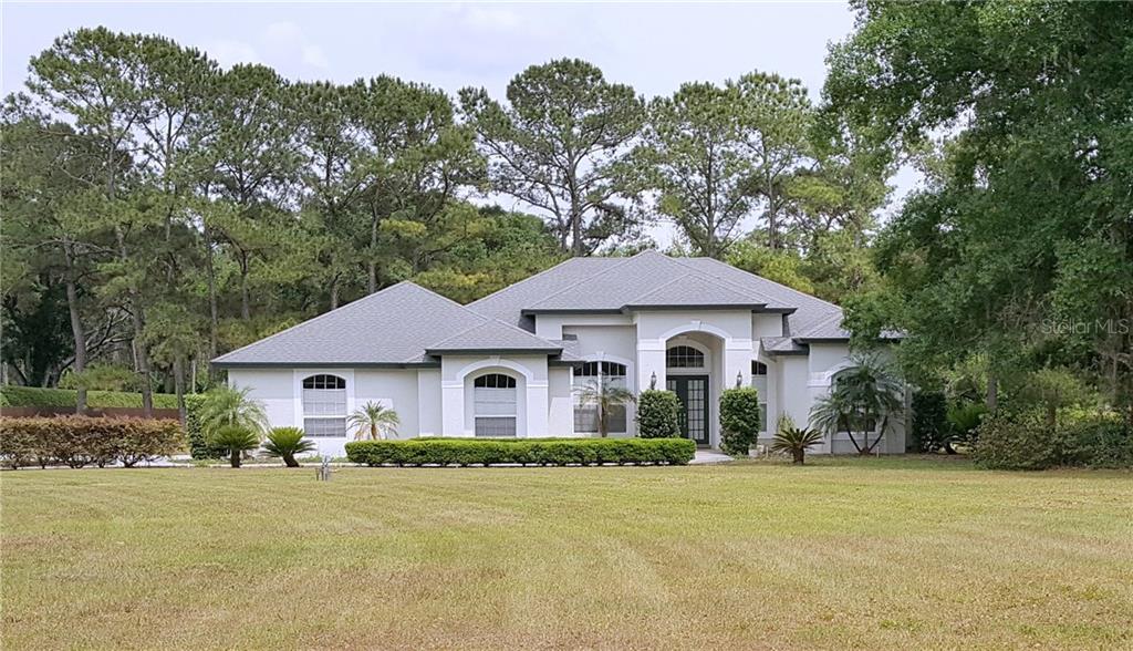 17911 Geraci Road Lutz, FL 33548 - Photo 1 of 1 Front of house w/garage entry on left