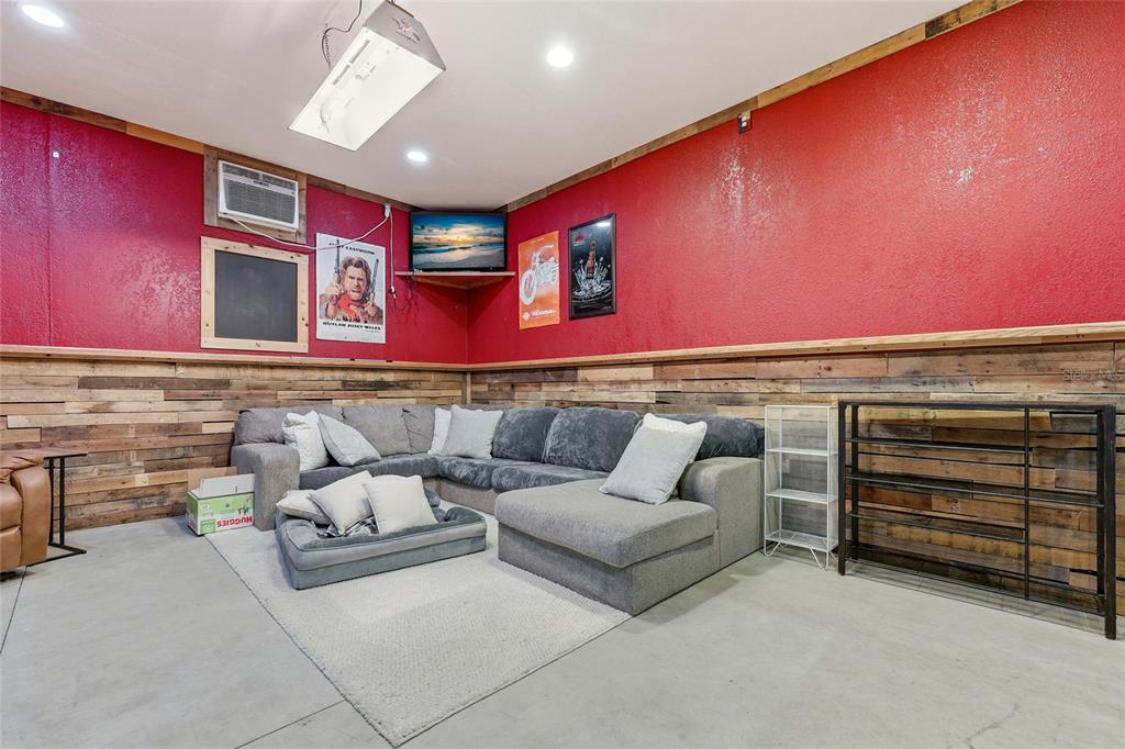 7119 Northeast 24th Loop High Springs, FL 32643 - Photo 29 of 35 a living room with furniture and a ceiling fan