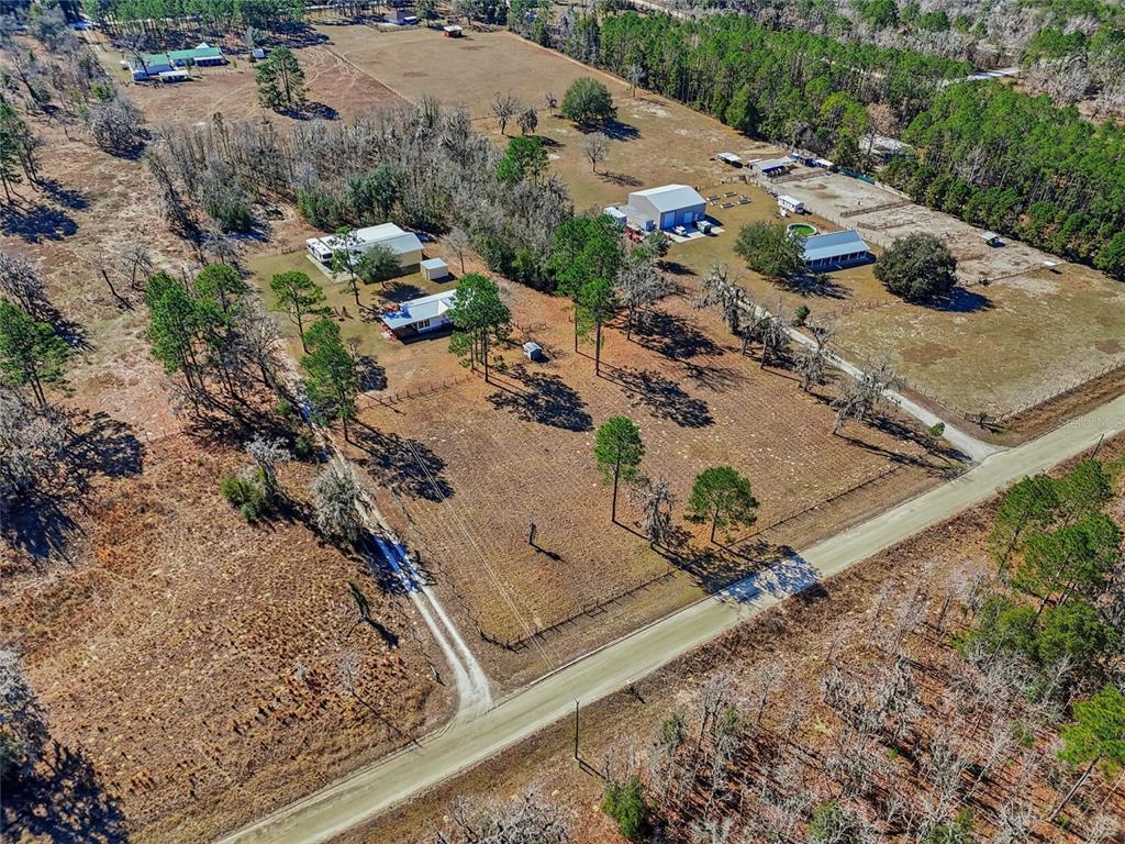 7119 Northeast 24th Loop High Springs, FL 32643 - Photo 32 of 35 an aerial view of a house with a yard