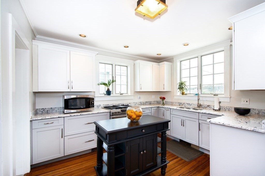 6 Oceanside Drive Scituate, MA 02066 - Photo 12 of 34 a kitchen with a sink stove and cabinets
