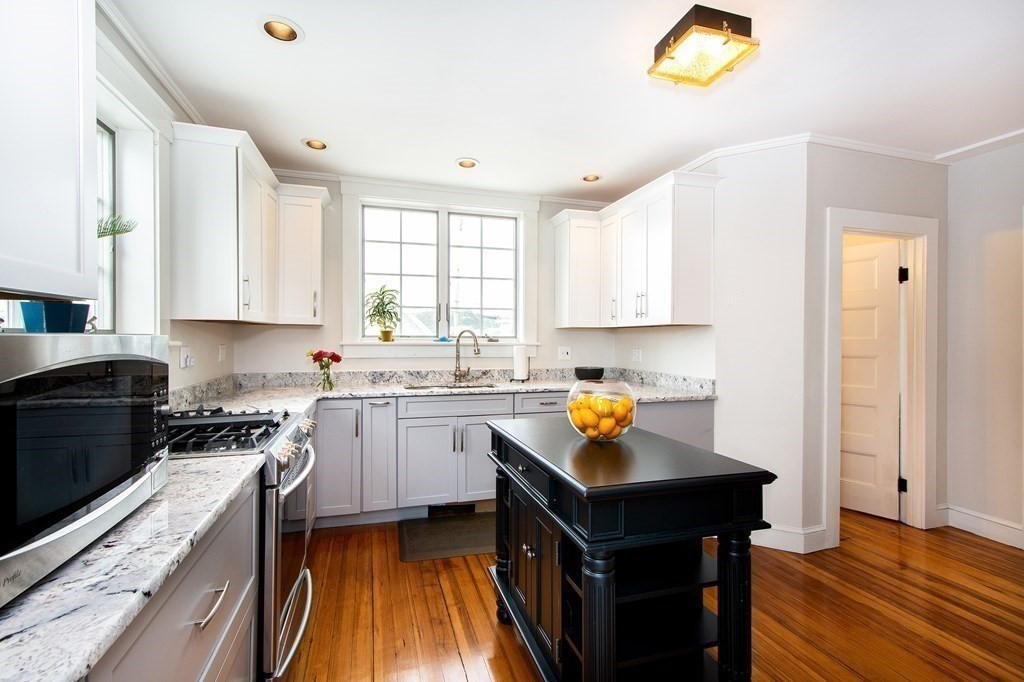 6 Oceanside Drive Scituate, MA 02066 - Photo 14 of 34 a kitchen with a sink a stove a counter space and cabinets