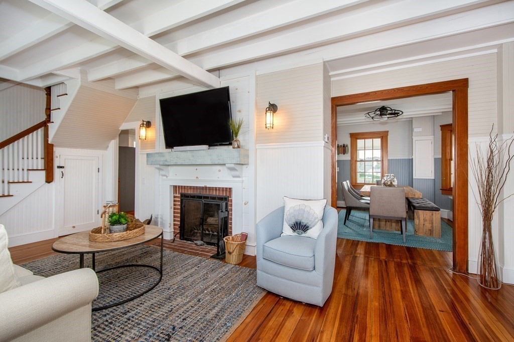 6 Oceanside Drive Scituate, MA 02066 - Photo 19 of 34 a living room with furniture and a fireplace