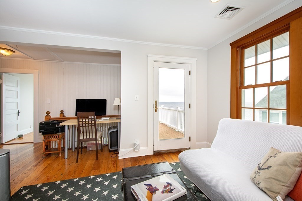 6 Oceanside Drive Scituate, MA 02066 - Photo 22 of 34 a living room with furniture and a flat screen tv