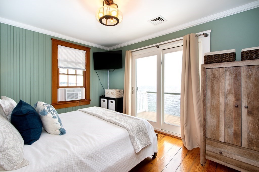 6 Oceanside Drive Scituate, MA 02066 - Photo 25 of 34 a bedroom with a bed and a window