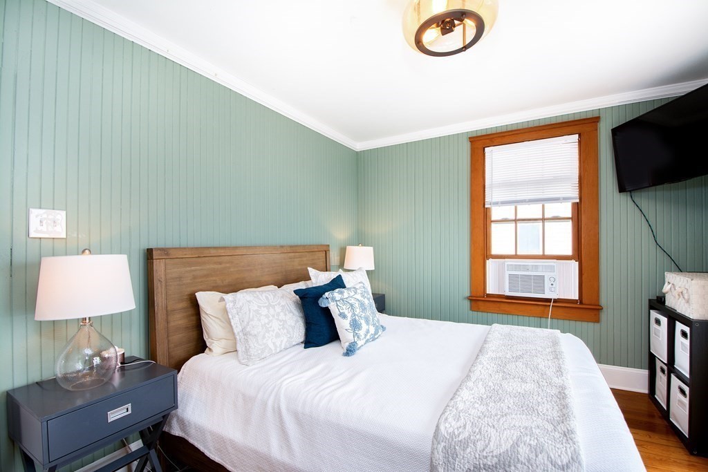 6 Oceanside Drive Scituate, MA 02066 - Photo 26 of 34 a bedroom with a bed and a window