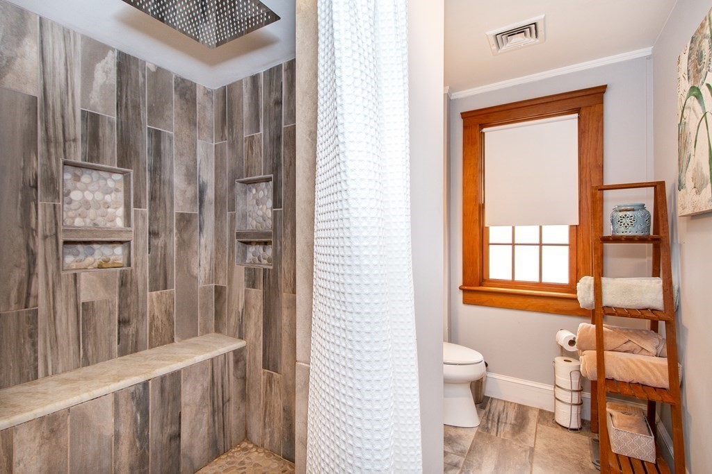 6 Oceanside Drive Scituate, MA 02066 - Photo 29 of 34 a bathroom with a toilet sink and a shower