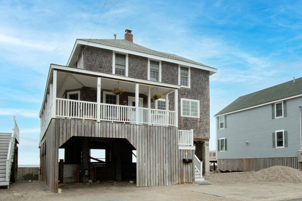 6 Oceanside Drive Scituate, MA 02066 - Photo 4 of 34 a front view of a house with a balcony