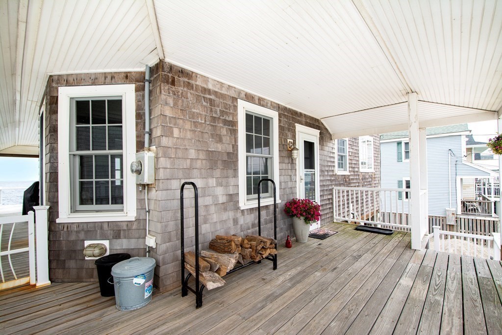 6 Oceanside Drive Scituate, MA 02066 - Photo 7 of 34 a view of balcony with couch and wooden floor