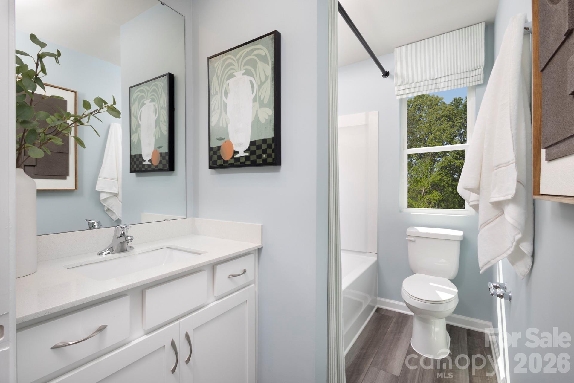 344 Laura Elizabeth Lane Clover, SC 29710 - Photo 13 of 19 a bathroom with a toilet sink and mirror