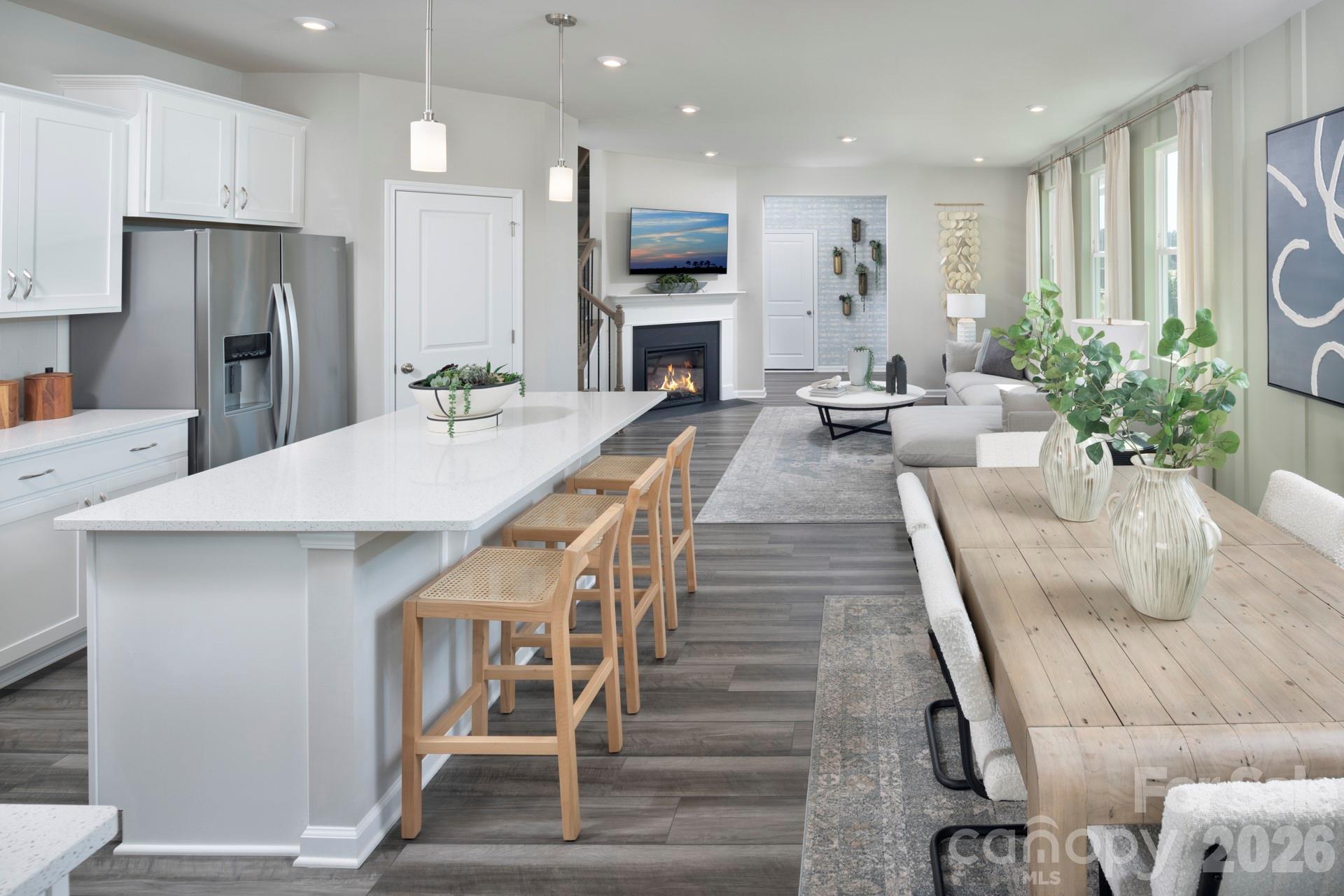 344 Laura Elizabeth Lane Clover, SC 29710 - Photo 3 of 19 a large kitchen with sink a refrigerator and chairs