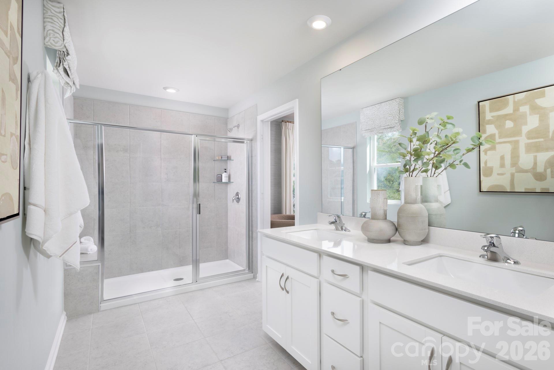 344 Laura Elizabeth Lane Clover, SC 29710 - Photo 9 of 19 a bathroom with double vanity sinks and a shower