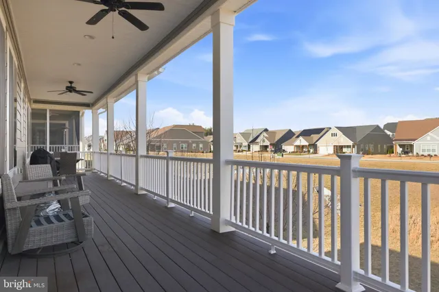 a kitchen with stainless steel appliances a stove a sink and white cabinets