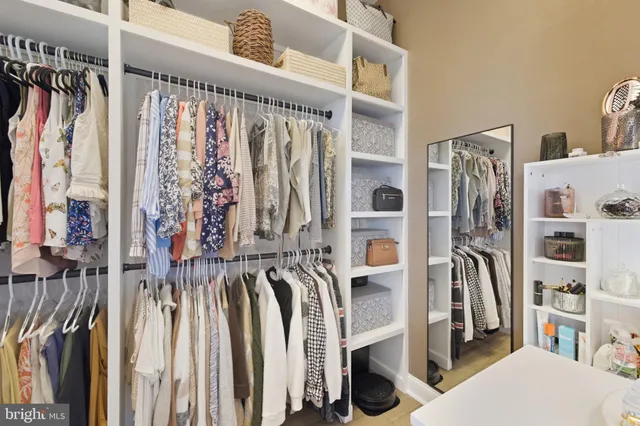 a bedroom with a bed lamp and a window