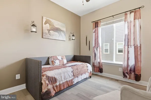 a bedroom with a bed and a couch