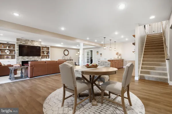 a kitchen with a sink a counter space appliances and cabinets