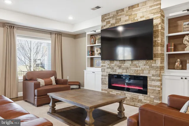 a spacious bedroom with a bed and a dresser