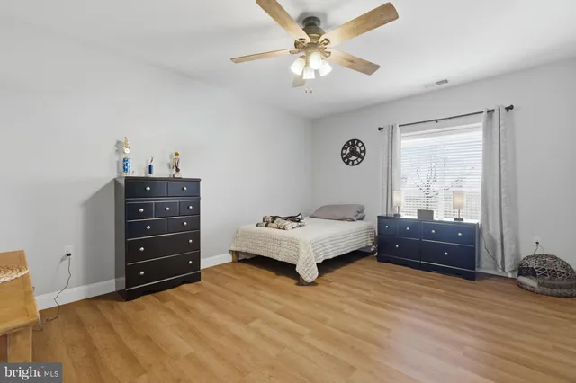 a bathroom with a double vanity sink toilet and shower
