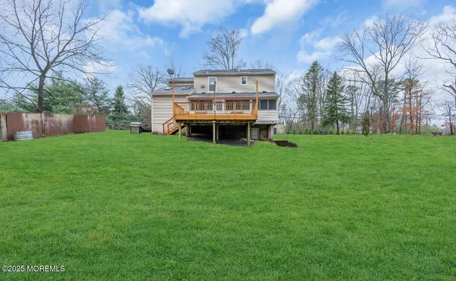 a view of a big yard with large trees and a big yard