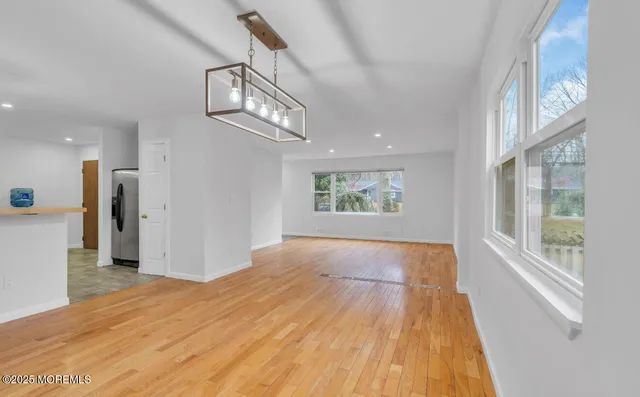 a view of an empty room and a window