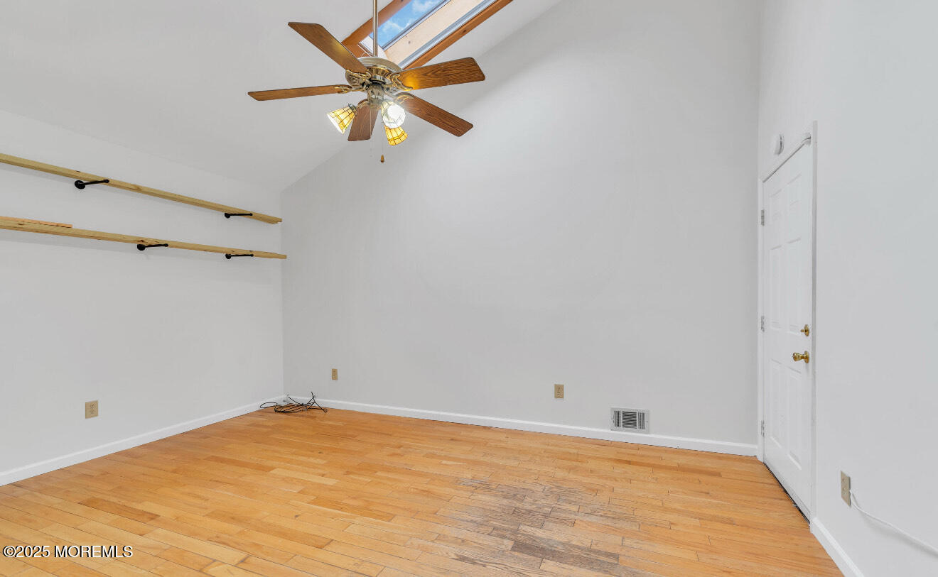 115 Leesville Road Jackson, NJ 08527 - Photo 6 of 15 a view of a big room with wooden floor and a ceiling fan
