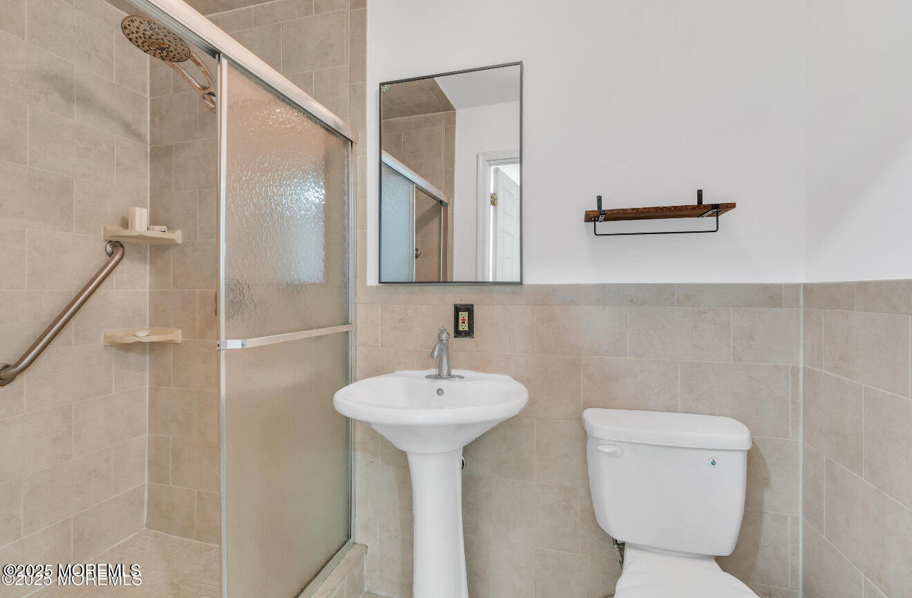 115 Leesville Road Jackson, NJ 08527 - Photo 10 of 15 a bathroom with a sink toilet and a mirror