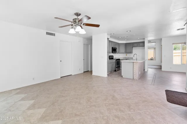 a view of a kitchen with a sink and cabinet