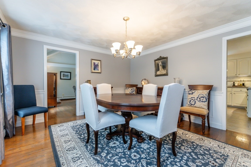 64 Wayside Inn Road Marlborough, MA 01752 - Photo 21 of 42 a view of a dining room with furniture and wooden floor