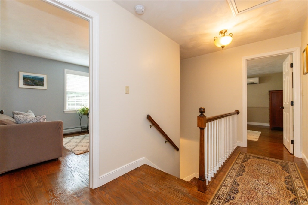 64 Wayside Inn Road Marlborough, MA 01752 - Photo 27 of 42 a view of a livingroom with furniture and hardwood floor