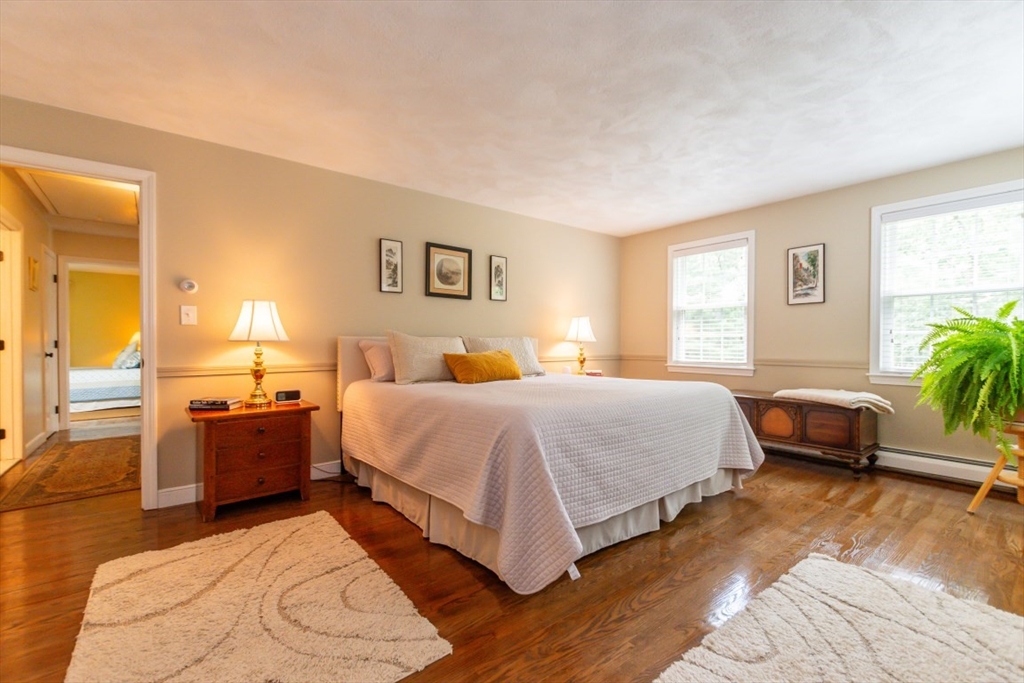 64 Wayside Inn Road Marlborough, MA 01752 - Photo 28 of 42 a spacious bedroom with a bed and a couch