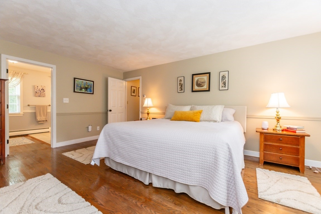 64 Wayside Inn Road Marlborough, MA 01752 - Photo 29 of 42 a bedroom with a bed and wooden floor