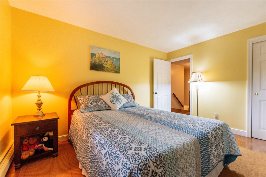 64 Wayside Inn Road Marlborough, MA 01752 - Photo 34 of 42 a bedroom with a bed and a lamp