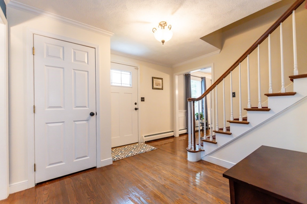 64 Wayside Inn Road Marlborough, MA 01752 - Photo 10 of 42 a view of an entryway with wooden floor and door