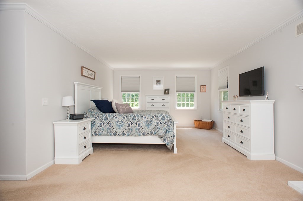 53 Armsby Road Sutton, MA 01590 - Photo 18 of 42 a bedroom with furniture and flat screen tv