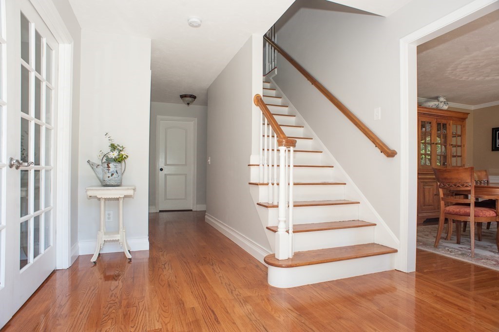 53 Armsby Road Sutton, MA 01590 - Photo 2 of 42 a view of entryway with wooden floor and stairs