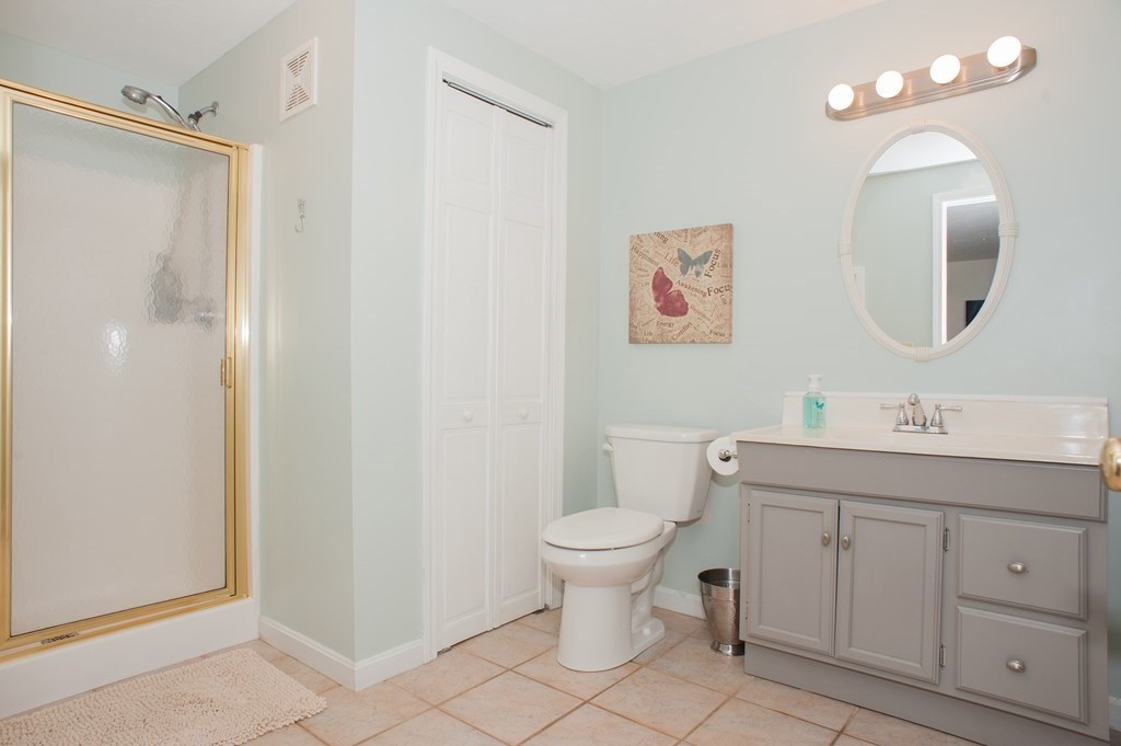 53 Armsby Road Sutton, MA 01590 - Photo 27 of 42 a bathroom with a toilet sink and mirror