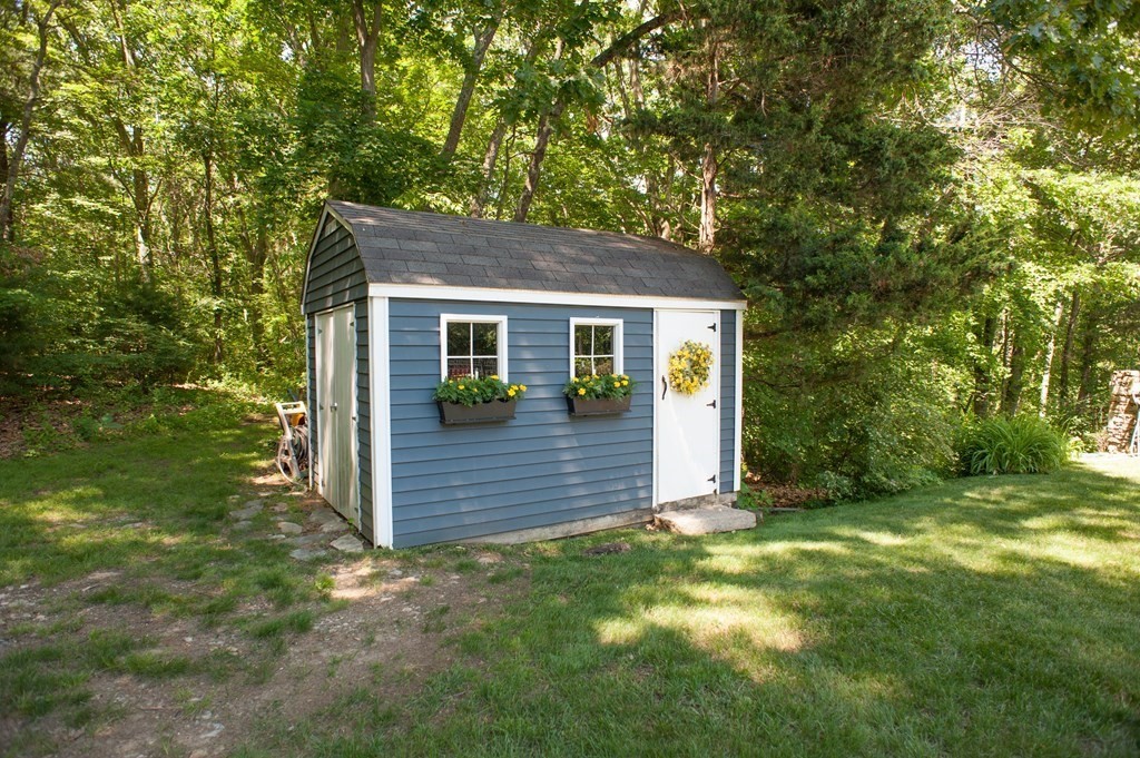 53 Armsby Road Sutton, MA 01590 - Photo 38 of 42 a view of a house with a yard