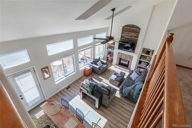a bedroom with a bed and a chandelier fan