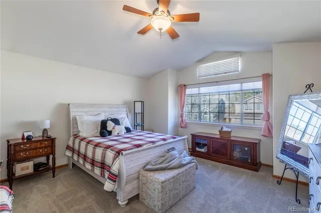 a bedroom with a bed dresser and a window