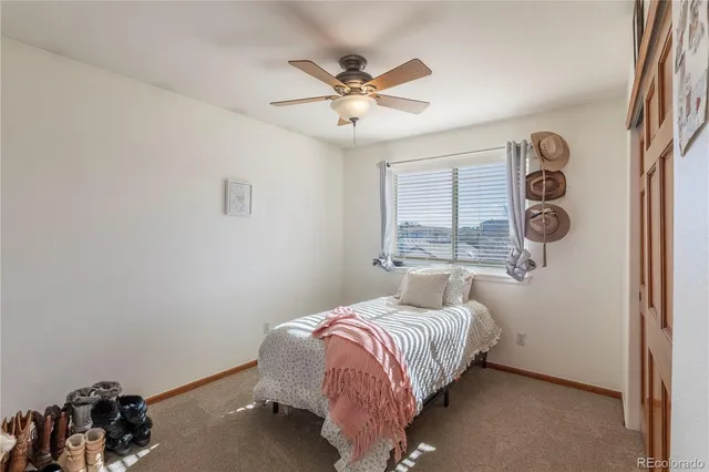 a bathroom with a granite countertop tub sink and mirror