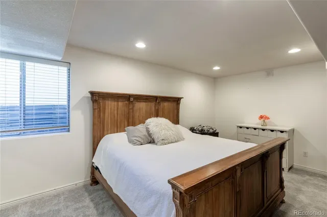 a dining room with furniture and a large window