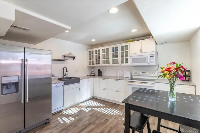 a bathroom with a sink toilet a mirror and shower
