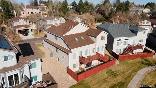 a view of multiple houses with a big yard