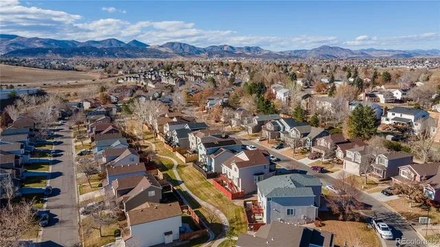 an aerial view of a house with a big yard