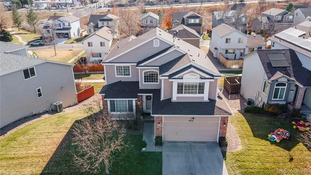 an aerial view of residential houses with an outdoor space