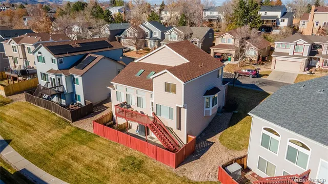 a view of a tree in front of a house