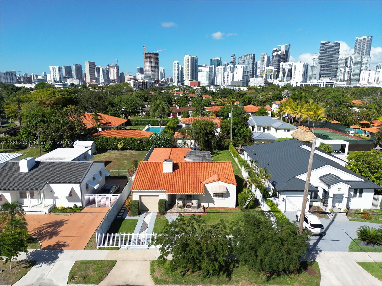 615 Southwest 21st Road Miami, FL 33129 - Photo 1 of 43 an aerial view of multiple houses with yard