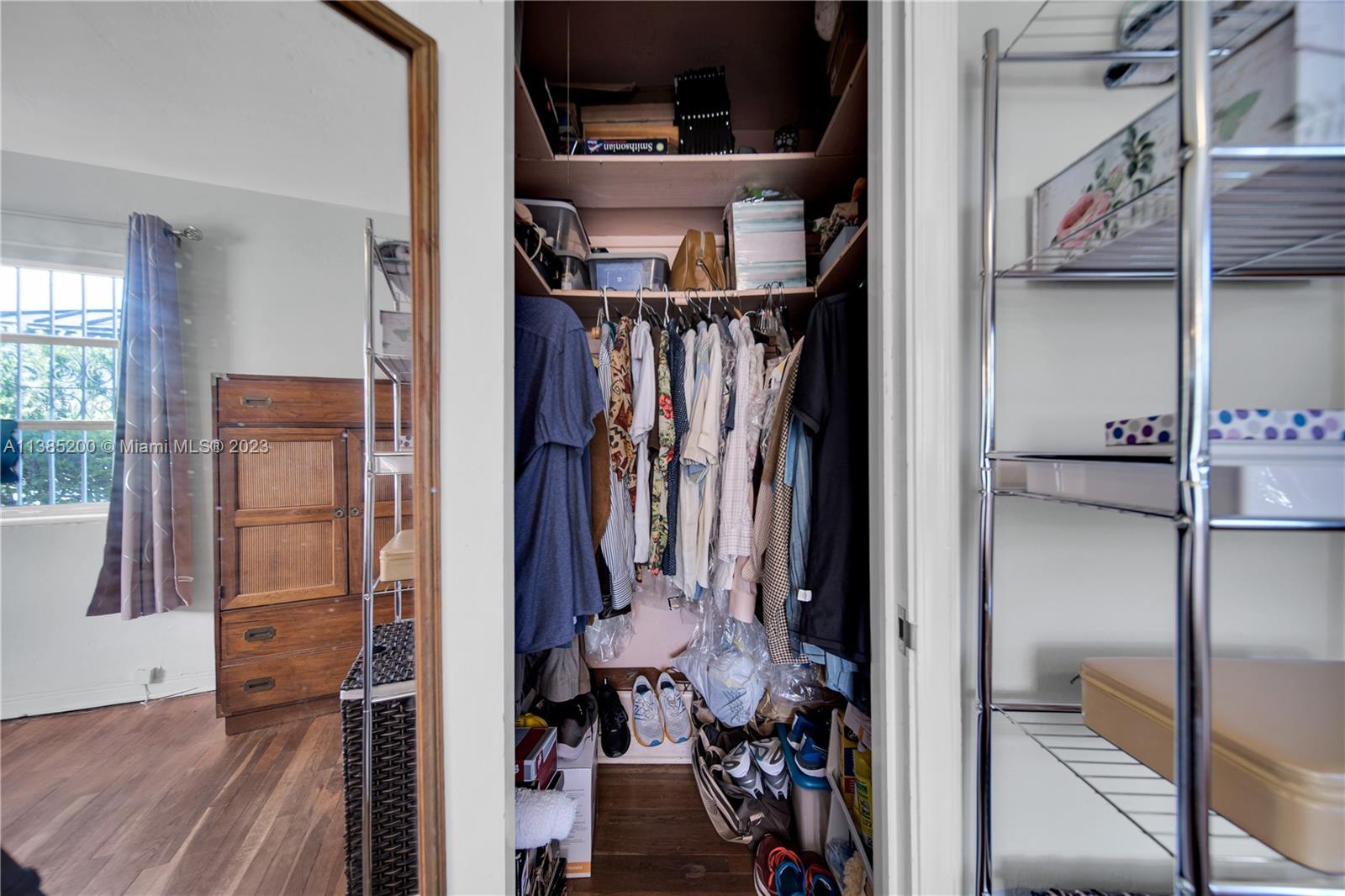 615 Southwest 21st Road Miami, FL 33129 - Photo 12 of 43 a view of walk in closet with clothes and shoes